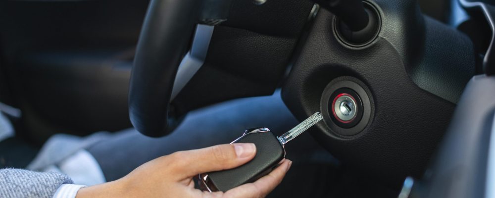 side-view-businesswoman-using-keys-turn-car